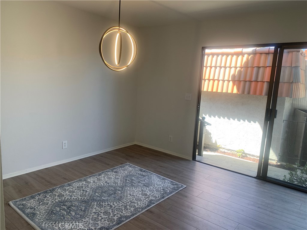 28000 Ridgebluff Court Rancho Palos Verdes, CA 90275 - Photo 32 of 33 an empty room with wooden floor and windows