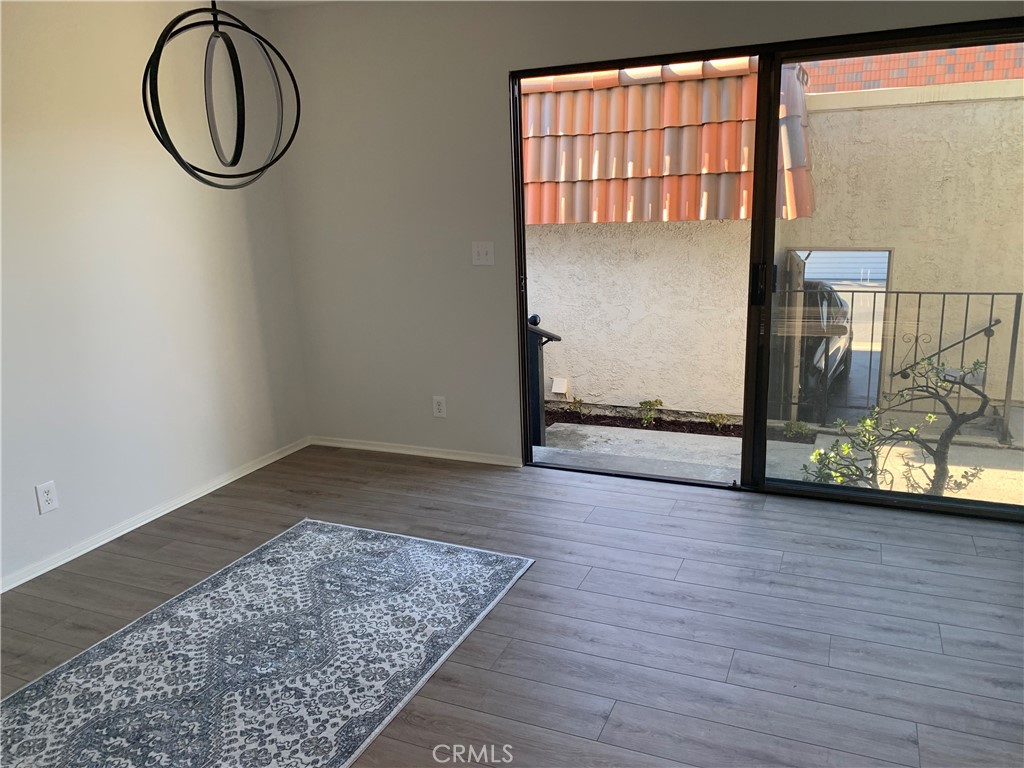 28000 Ridgebluff Court Rancho Palos Verdes, CA 90275 - Photo 6 of 33 an empty room with wooden floor and windows