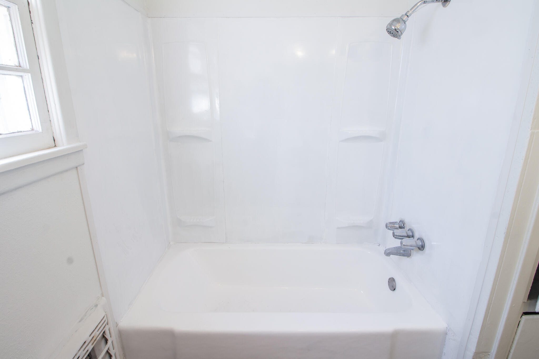 4621 35th Street Lubbock, TX 79414 - Photo 16 of 19 a bathroom with a bathtub