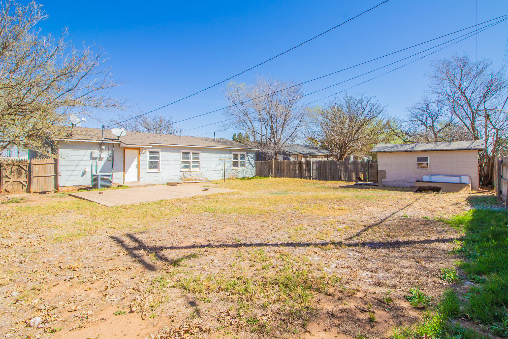 4621 35th Street Lubbock, TX 79414 - Photo 17 of 19 a house with swimming pool in front of it