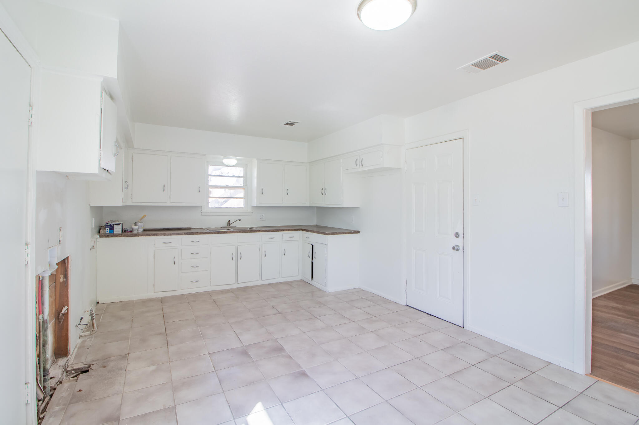 4621 35th Street Lubbock, TX 79414 - Photo 7 of 19 a view of kitchen with white cabinets