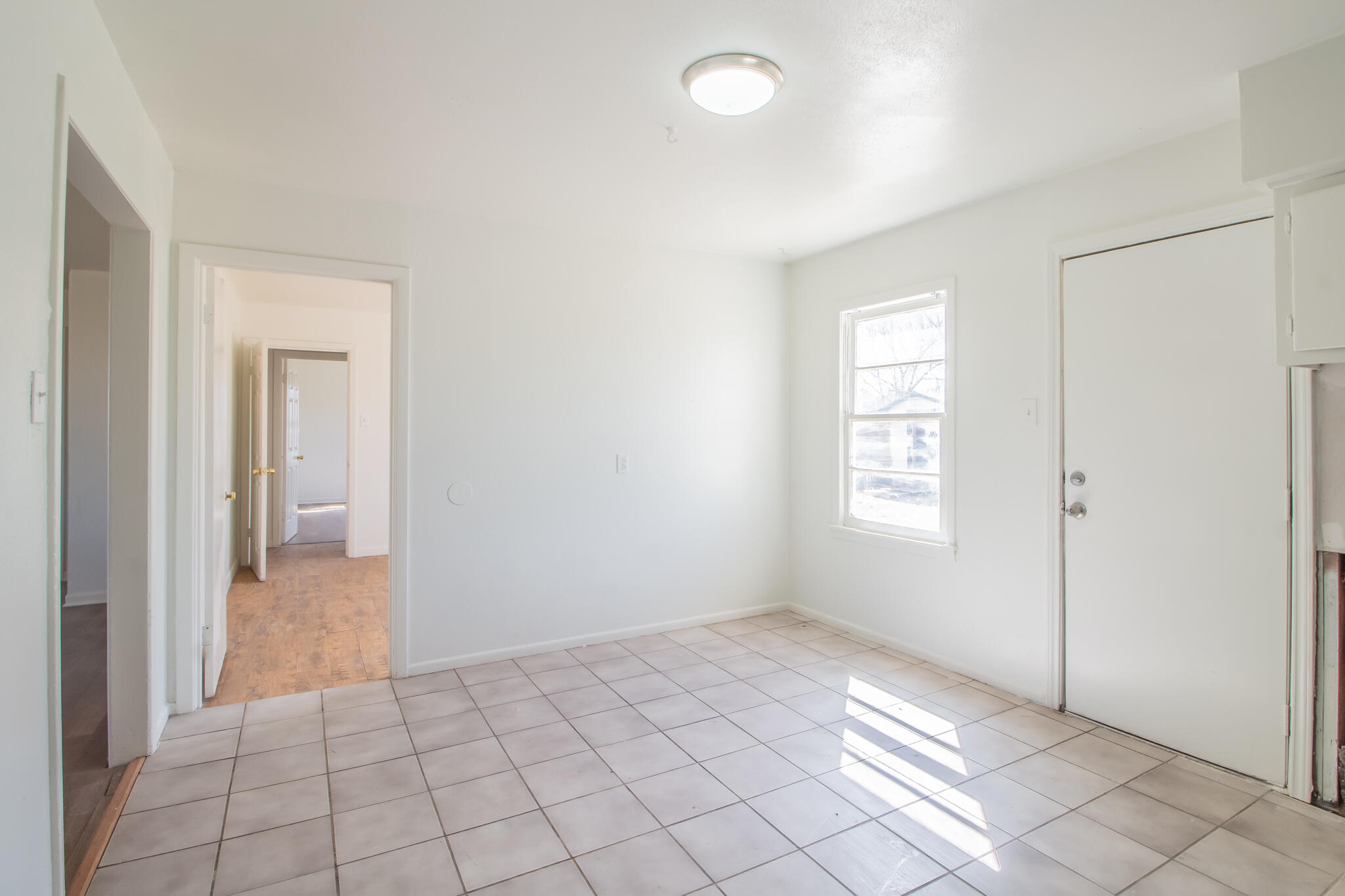 4621 35th Street Lubbock, TX 79414 - Photo 10 of 19 a view of an empty room and window