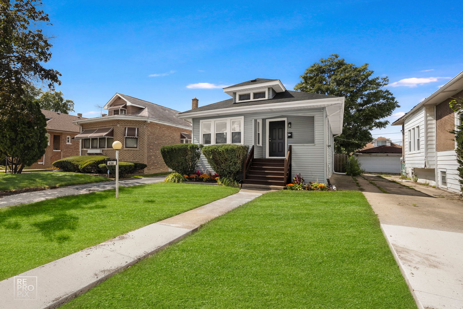 628 South 19th Avenue Maywood, IL 60153 - Photo 1 of 10 a front view of a house with a yard