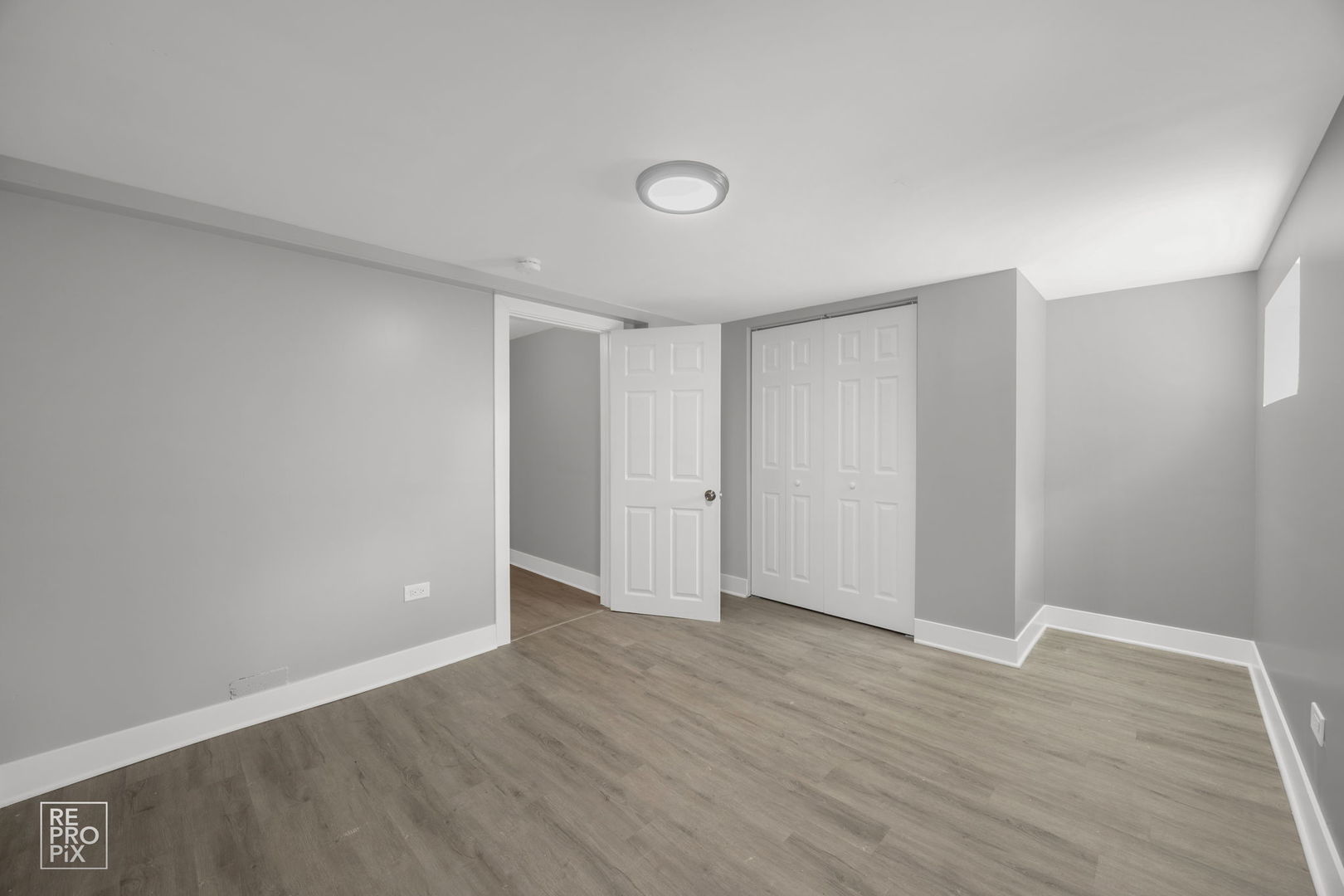 628 South 19th Avenue Maywood, IL 60153 - Photo 10 of 10 a view of an empty room with wooden floor