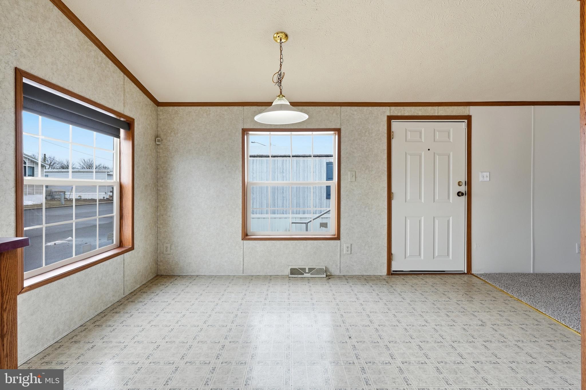 507 Canter Road Wilmington, DE 19810 - Photo 6 of 15 a view of an empty room with a window