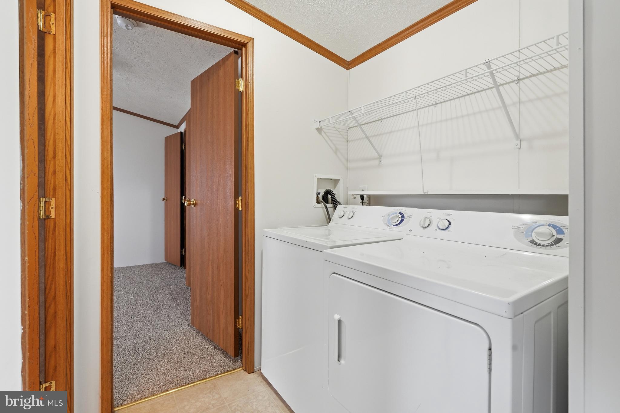 507 Canter Road Wilmington, DE 19810 - Photo 9 of 15 a utility room with dryer and washer