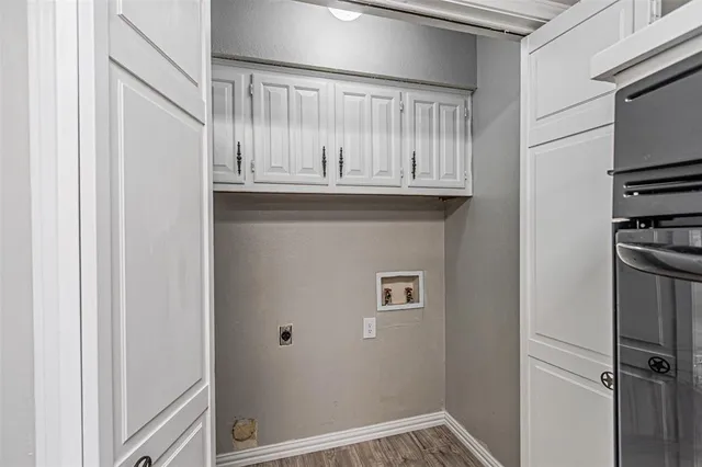 a kitchen with granite countertop a sink stove and refrigerator