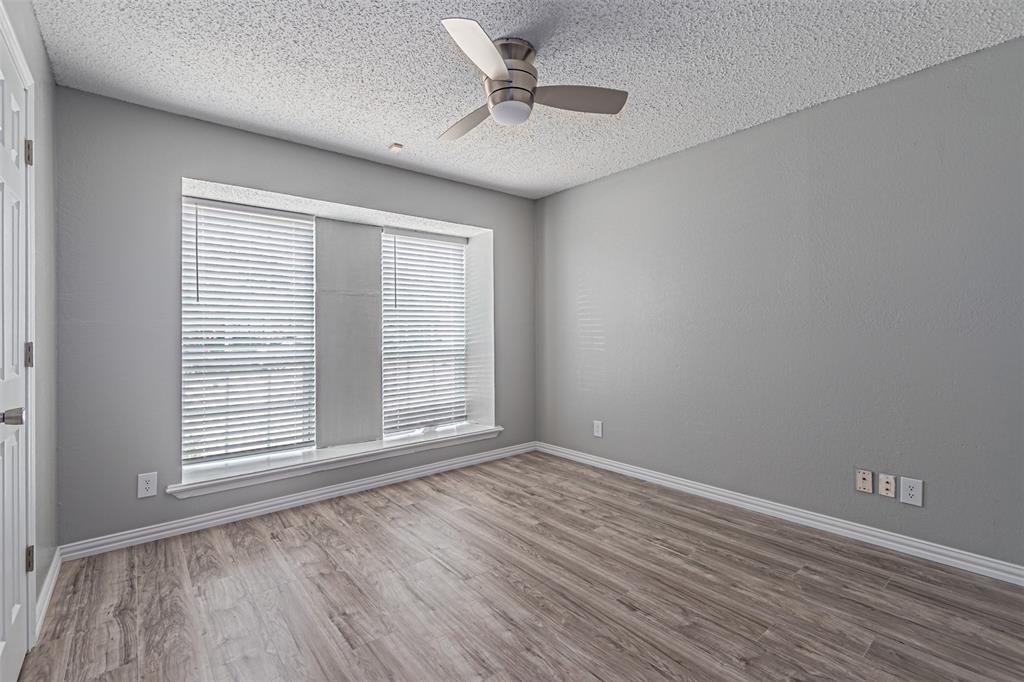 2435 Old Mill Road Dallas, TX 75287 - Photo 21 of 30 wooden floor in an empty room with a window