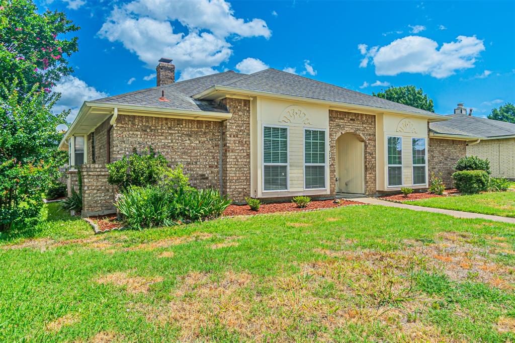2435 Old Mill Road Dallas, TX 75287 - Photo 3 of 30 front view of a house with a yard