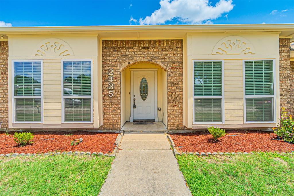 2435 Old Mill Road Dallas, TX 75287 - Photo 4 of 30 a front view of a house with a yard