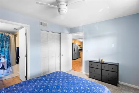 a bathroom with a sink mirror vanity and toilet
