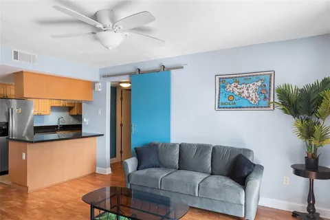 a living room with furniture and a flat screen tv