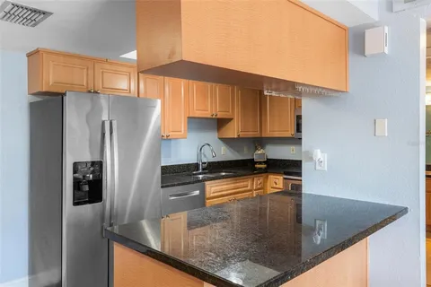 a living room with kitchen island furniture and a large window