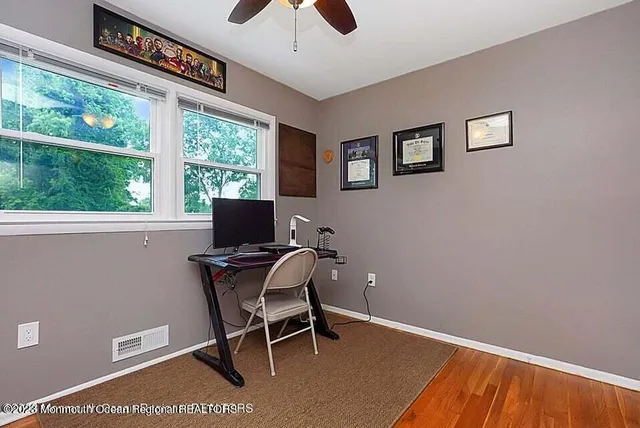 a workspace with furniture and a window