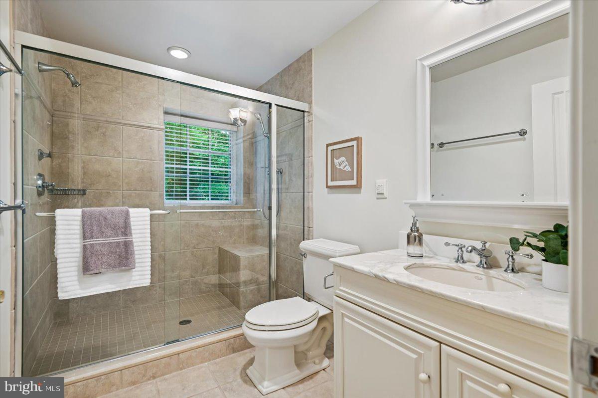 2700 Falling Timber Trail Edgewater, MD 21037 - Photo 49 of 89 a bathroom with a sink a toilet and shower