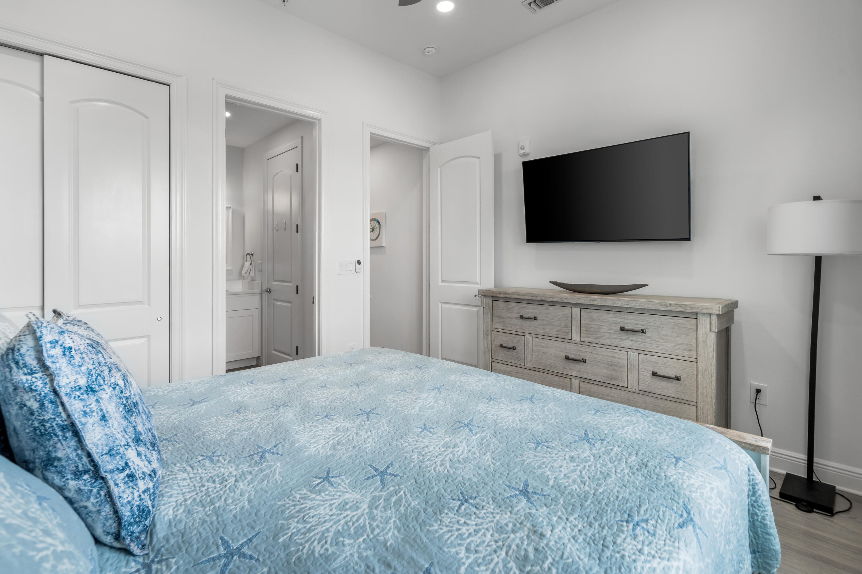 1740 South County Highway, Unit 301 Santa Rosa Beach, FL 32459 - Photo 18 of 45 a bedroom with a bed and a flat screen tv