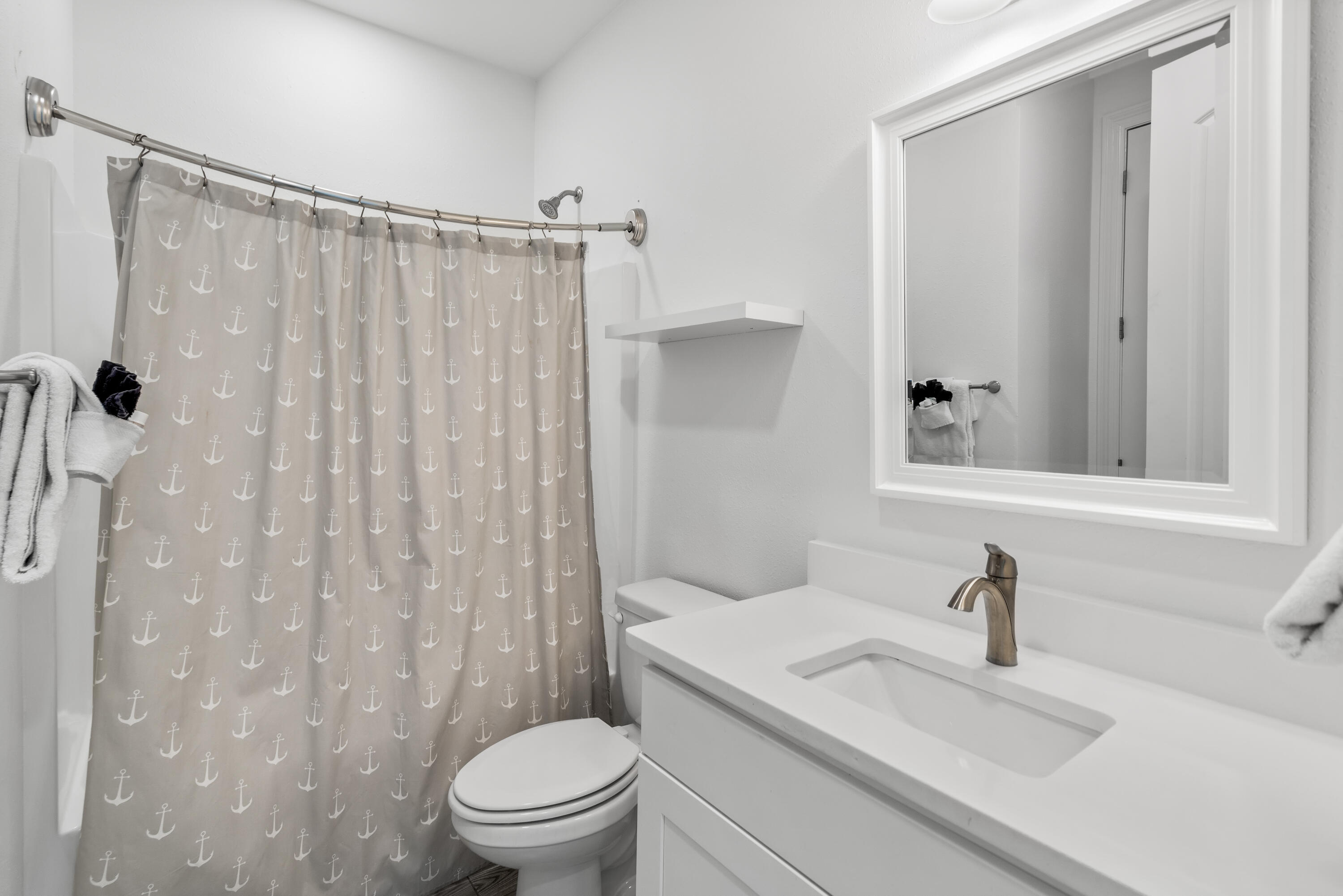 1740 South County Highway, Unit 301 Santa Rosa Beach, FL 32459 - Photo 19 of 45 a bathroom with a sink a toilet and shower