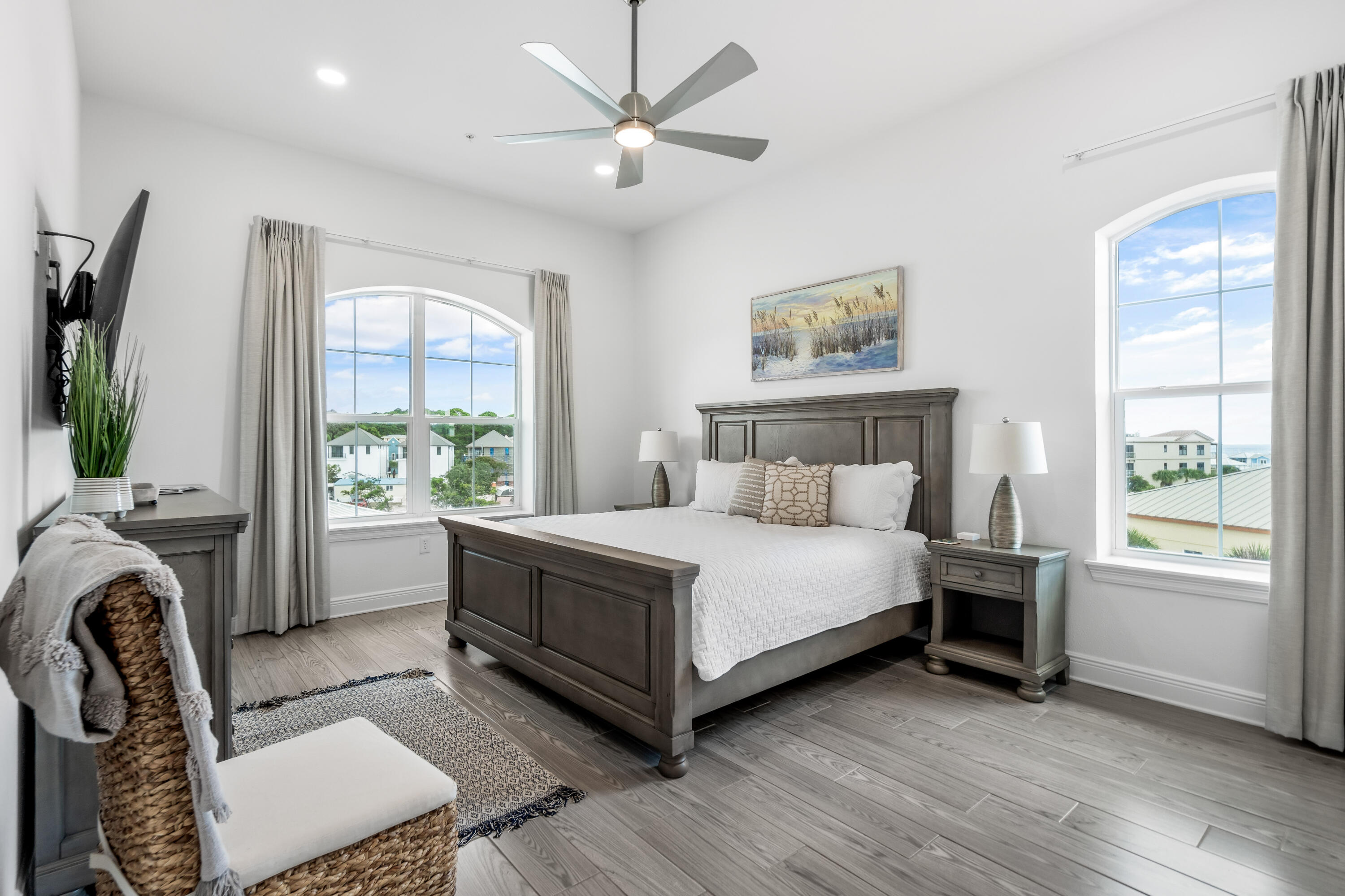 1740 South County Highway, Unit 301 Santa Rosa Beach, FL 32459 - Photo 22 of 45 a bedroom with a bed couch and a large window