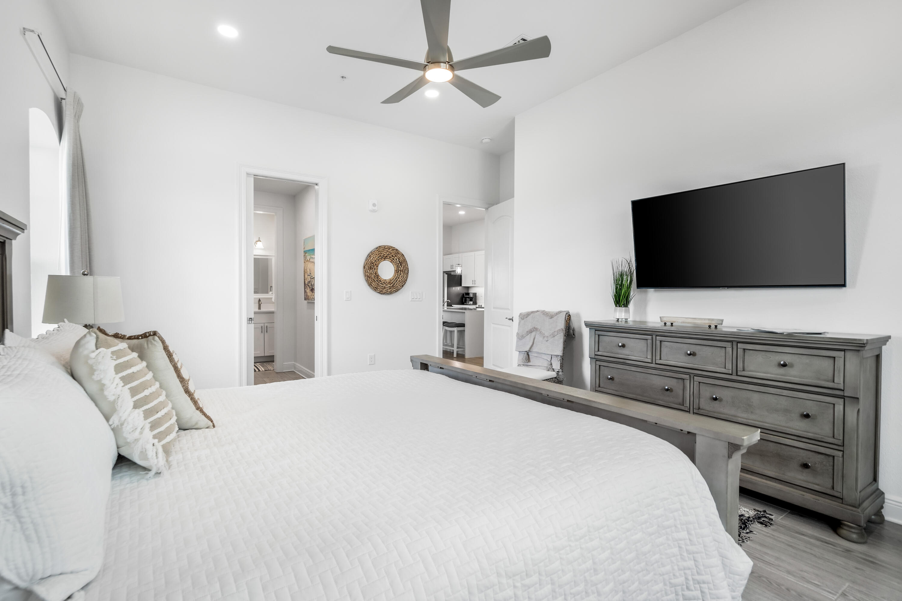 1740 South County Highway, Unit 301 Santa Rosa Beach, FL 32459 - Photo 24 of 45 a bedroom with a bed and a flat screen tv