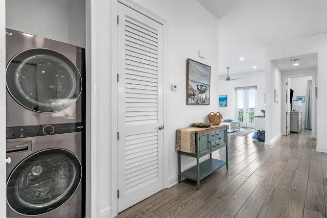 a living room with furniture a fireplace and wooden floor