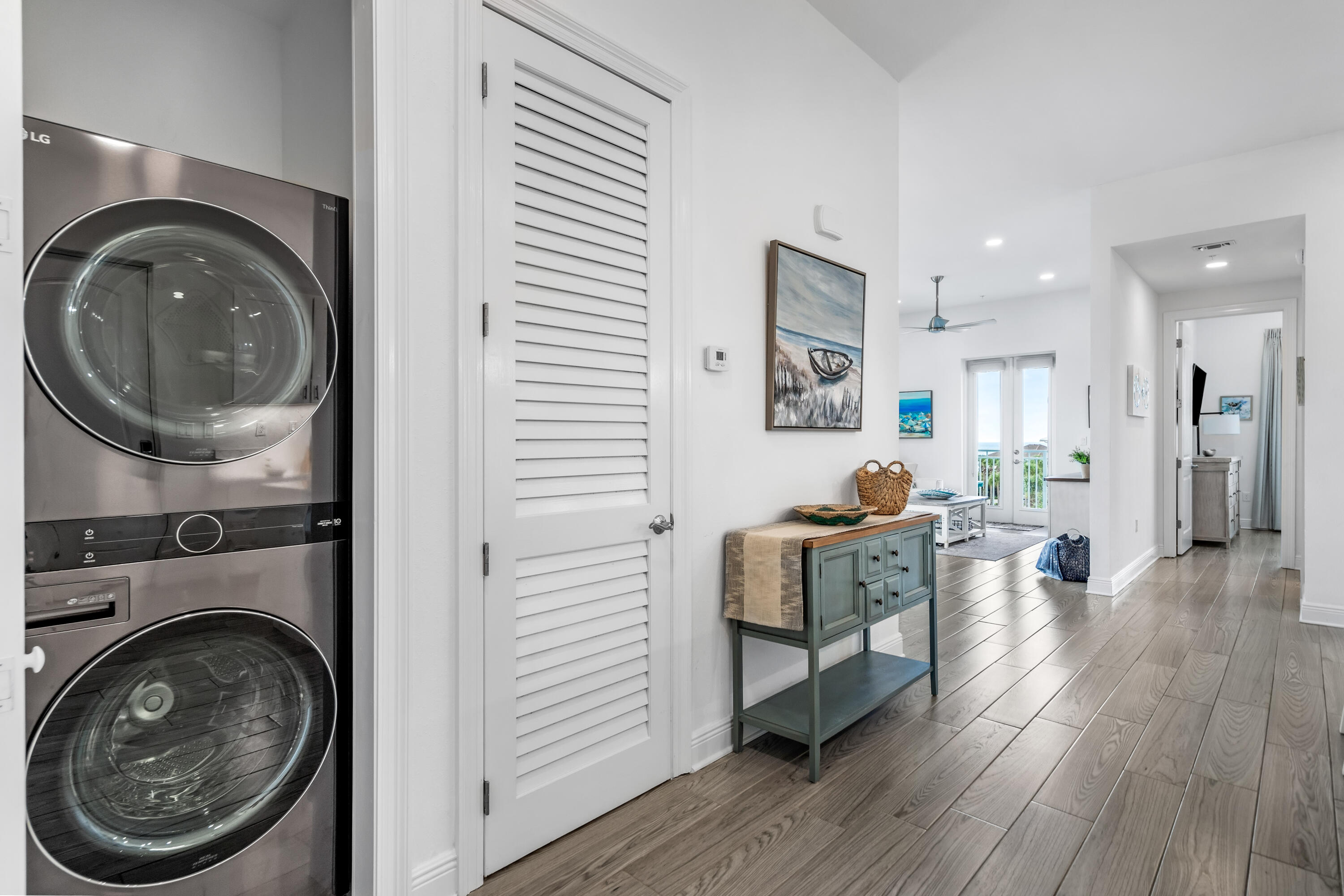1740 South County Highway, Unit 301 Santa Rosa Beach, FL 32459 - Photo 26 of 45 a living room with furniture a fireplace and wooden floor