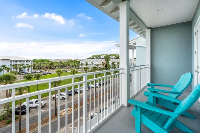 a view of balcony with furniture and city view