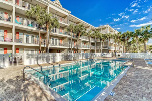 a view of swimming pool with a deck and a garden