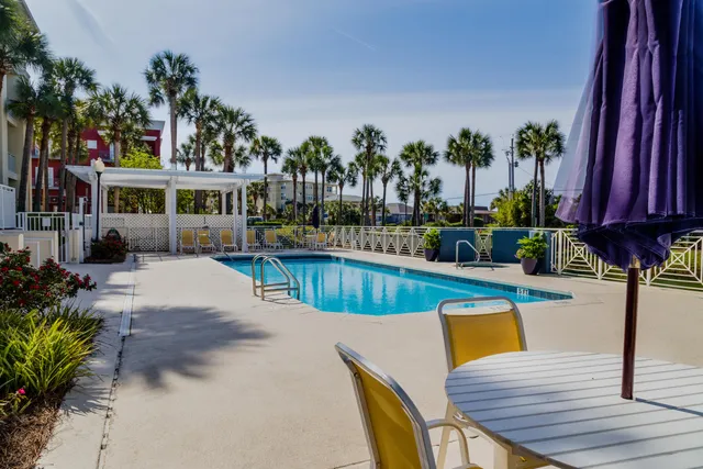 a view of a big building next to a yard