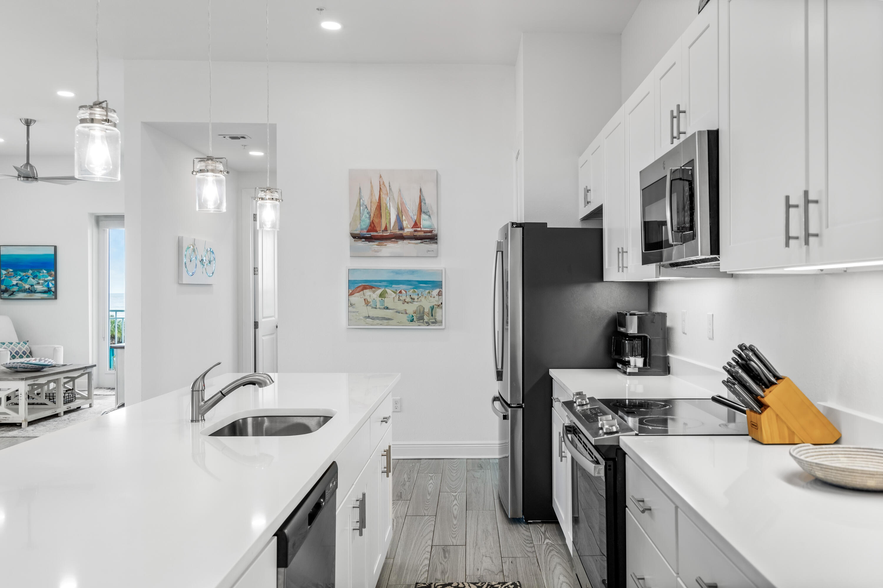 1740 South County Highway, Unit 301 Santa Rosa Beach, FL 32459 - Photo 6 of 45 a kitchen with a sink stove and refrigerator