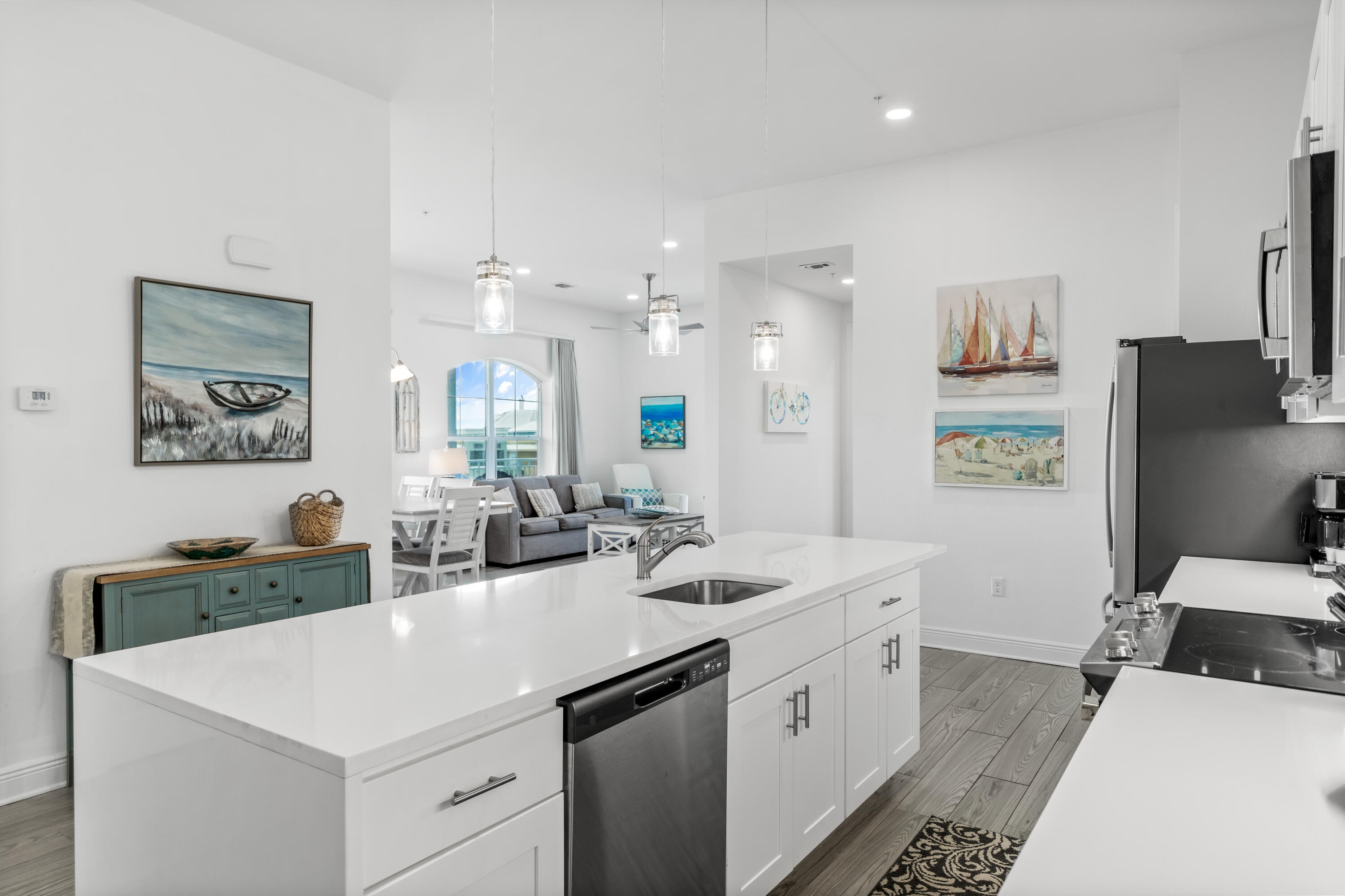 1740 South County Highway, Unit 301 Santa Rosa Beach, FL 32459 - Photo 7 of 45 a view of a kitchen area with furniture and wooden floor