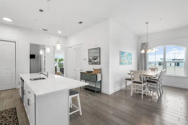 a kitchen with a table and chairs in it