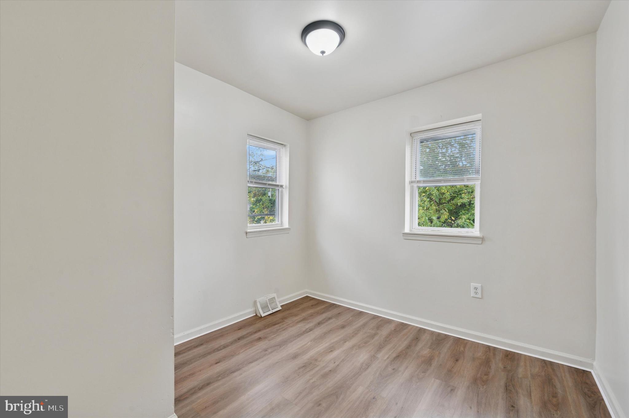 1016 Potter Street Chester, PA 19013 - Photo 11 of 15 an empty room with a window