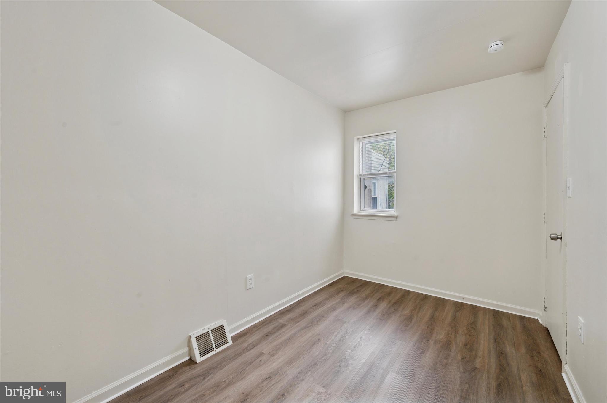 1016 Potter Street Chester, PA 19013 - Photo 13 of 15 a view of a room with wooden floor and white walls