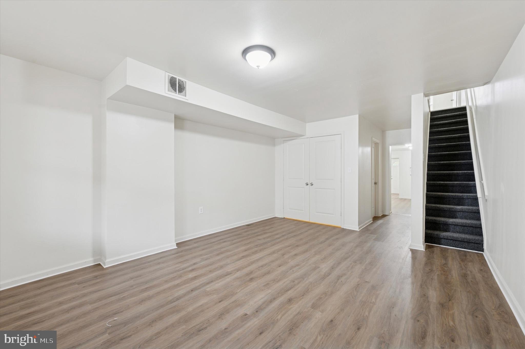 1016 Potter Street Chester, PA 19013 - Photo 2 of 15 a view of an empty room with wooden floor