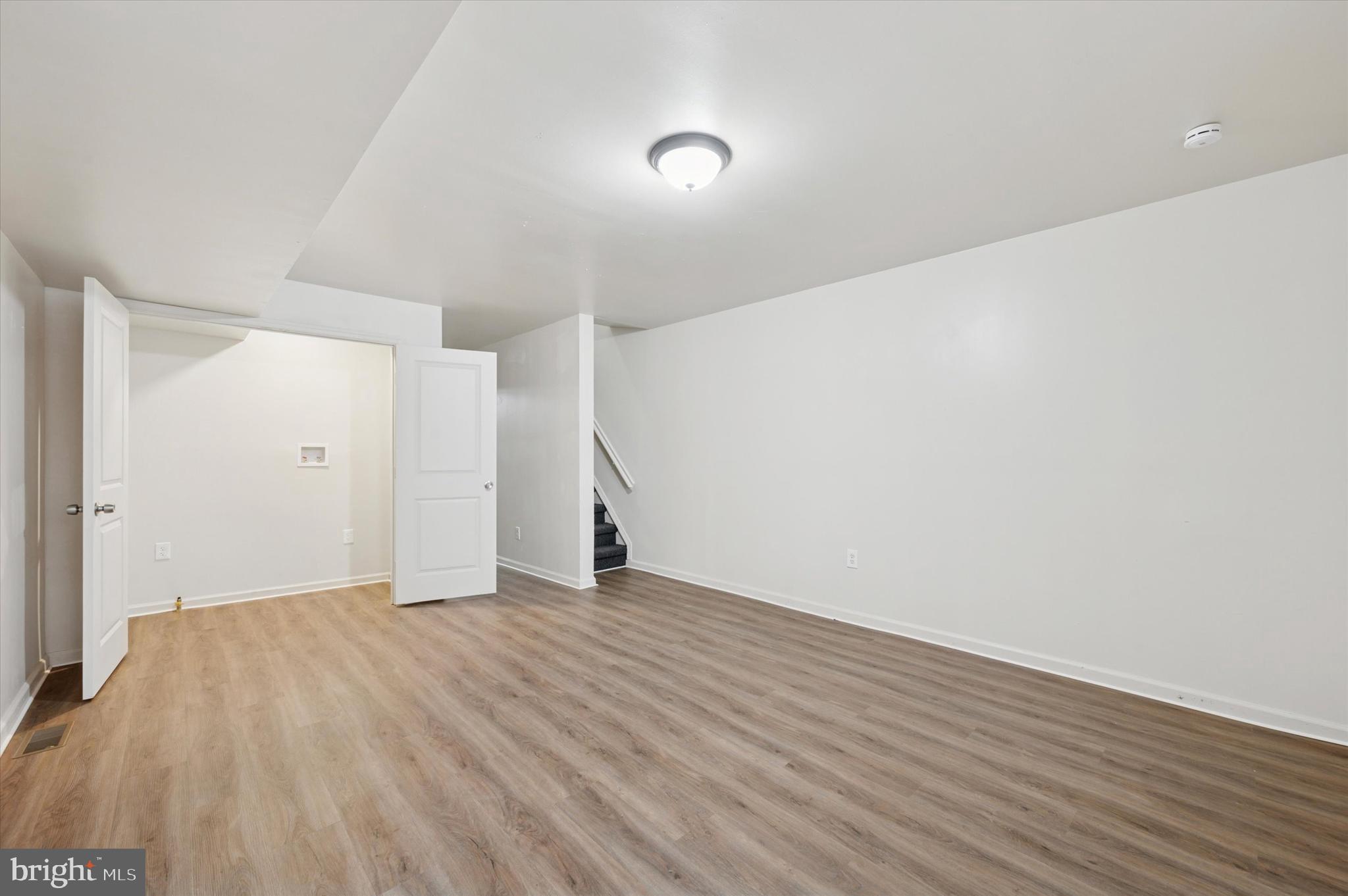1016 Potter Street Chester, PA 19013 - Photo 3 of 15 a view of an empty room with wooden floor