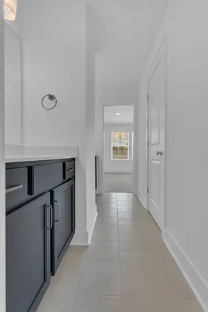 a room with a sink and a mirror