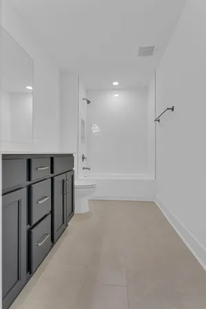 a bathroom with a bathtub and a toilet