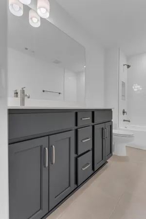 a view of a house with yard and sitting area