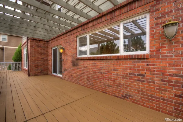 a view of a brick house with many windows