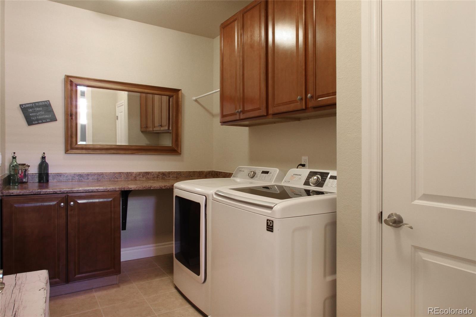 9228 Ridgegate Parkway Lone Tree, CO 80124 - Photo 19 of 32 a kitchen with a sink and cabinets