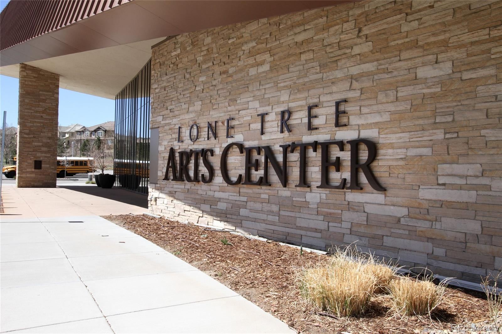 9228 Ridgegate Parkway Lone Tree, CO 80124 - Photo 25 of 32 a front view of a building with parking
