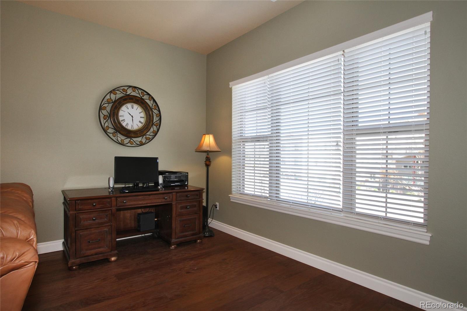 9228 Ridgegate Parkway Lone Tree, CO 80124 - Photo 6 of 32 a view of a workspace with furniture and a window