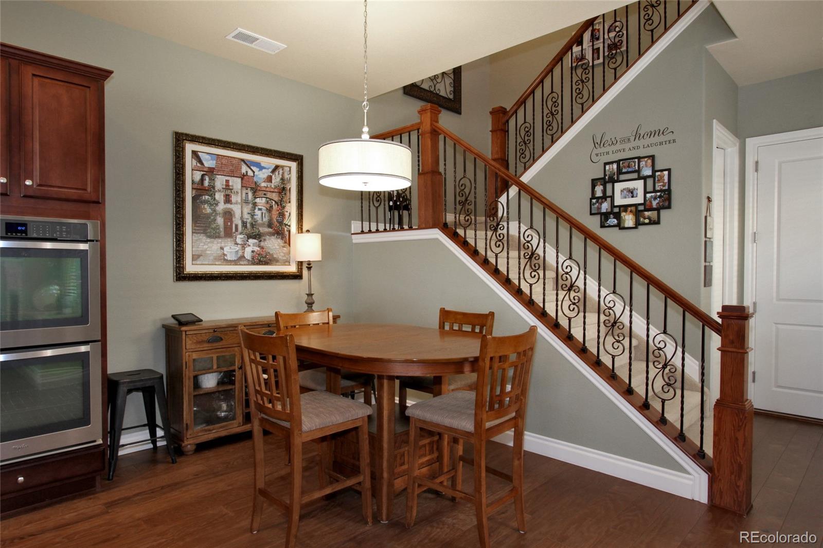 9228 Ridgegate Parkway Lone Tree, CO 80124 - Photo 10 of 32 a view of a livingroom with furniture stairs wooden floor and staircase