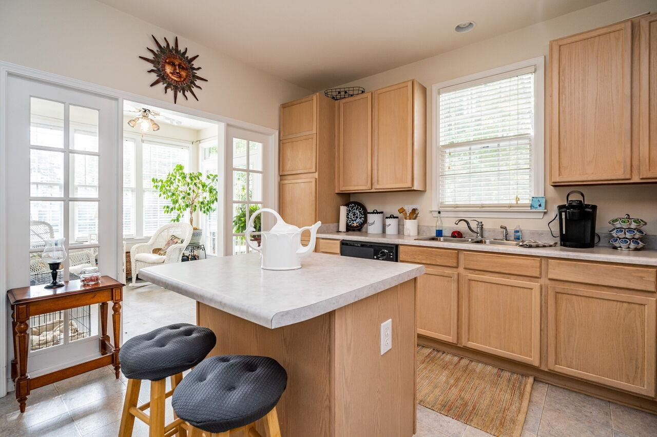 5641 Picnic Rock Lane Raleigh, NC 27613 - Photo 15 of 23 a kitchen with a sink a window and cabinets
