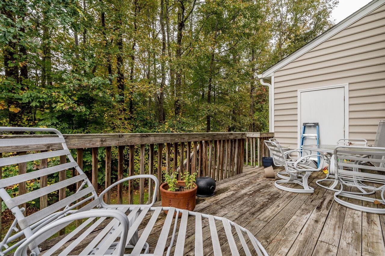 5641 Picnic Rock Lane Raleigh, NC 27613 - Photo 23 of 23 a view of balcony with wooden floor and fence