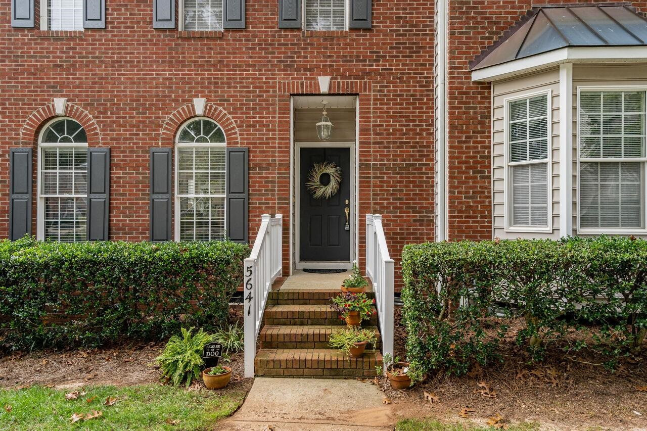 5641 Picnic Rock Lane Raleigh, NC 27613 - Photo 3 of 23 a front view of a house with a garden