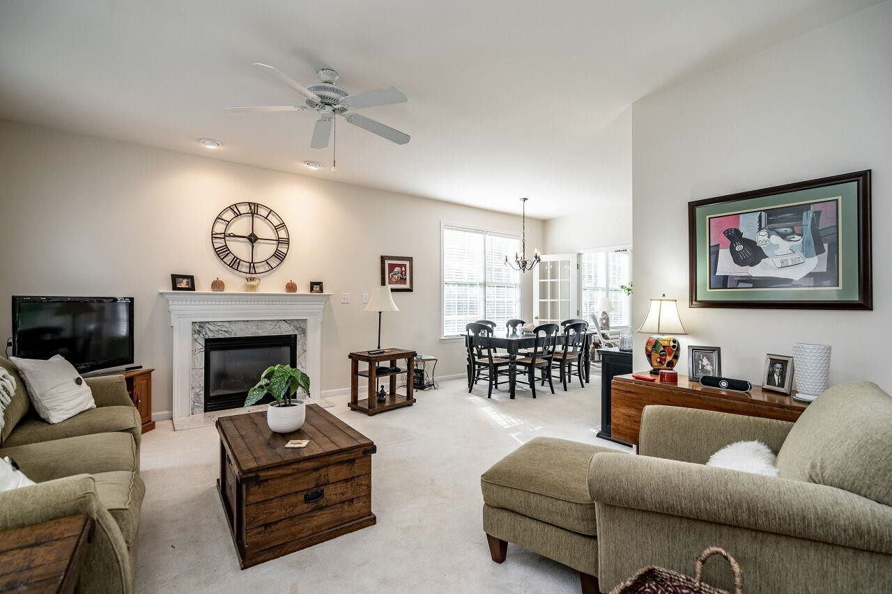 5641 Picnic Rock Lane Raleigh, NC 27613 - Photo 5 of 23 a living room with furniture and a fireplace