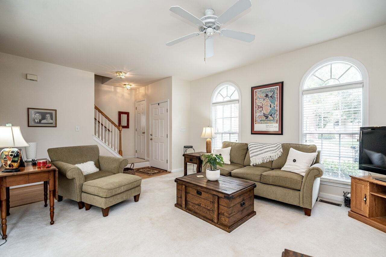 5641 Picnic Rock Lane Raleigh, NC 27613 - Photo 8 of 23 a living room with furniture and a large window