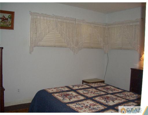 2 Colfax Road Edison, NJ 08817 - Photo 14 of 25 a bedroom with a bed