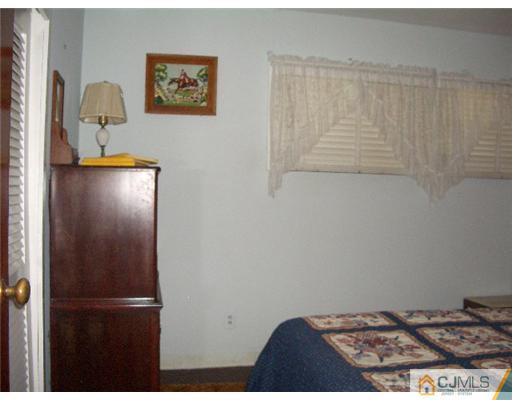 2 Colfax Road Edison, NJ 08817 - Photo 15 of 25 a view of kitchen with cabinets and window